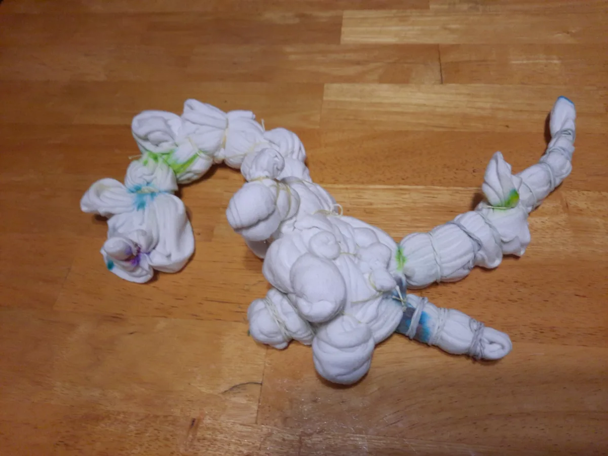 A detailed bundle of tied fabric on Rob’s work table before dyeing