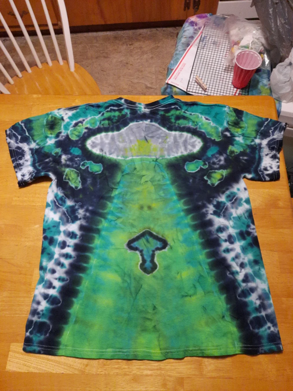 A UFO and mushroom shirt showing what hand-tied color can become